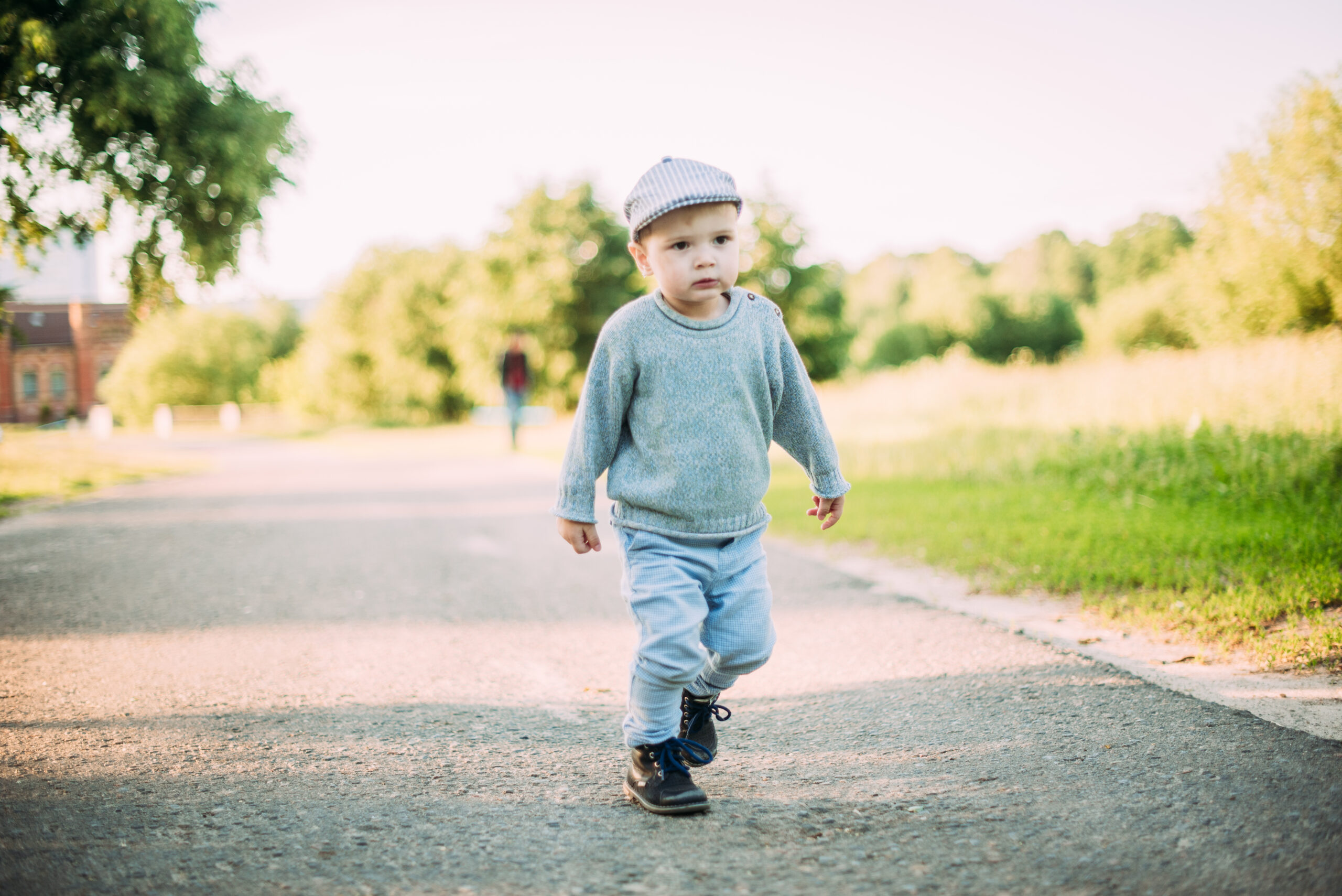 Cute and handsome baby boy 1-2 years old exploring nature in summer, having fun